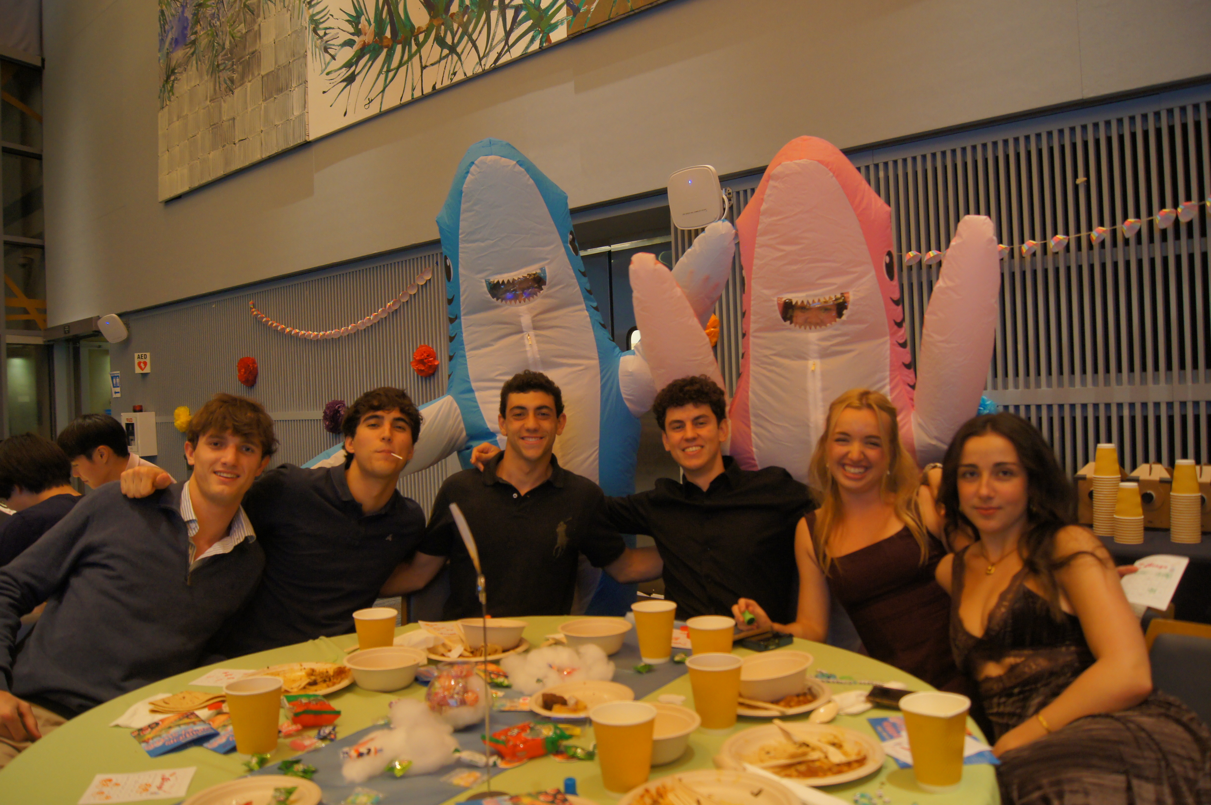 UC San Diego students at I-House smiling for a picture at Sunday Supper
