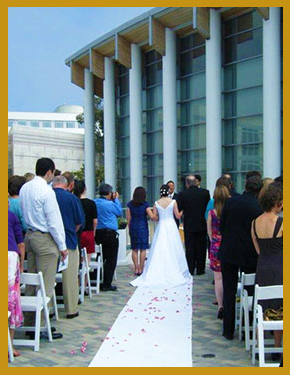 Photo of an outdoor wedding ceremony, a lovely event held at UC San Diego's Great Hall